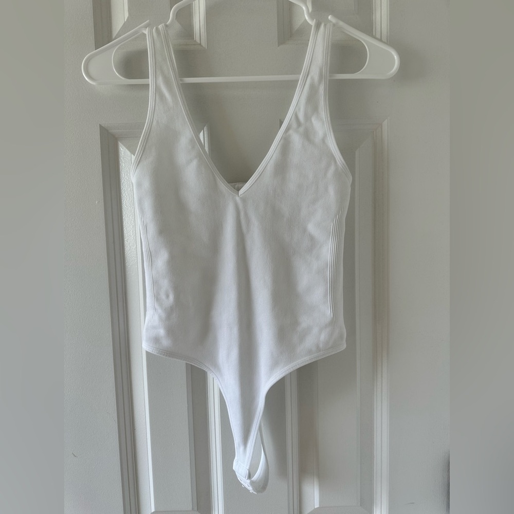Womens white ribbed bodysuit.